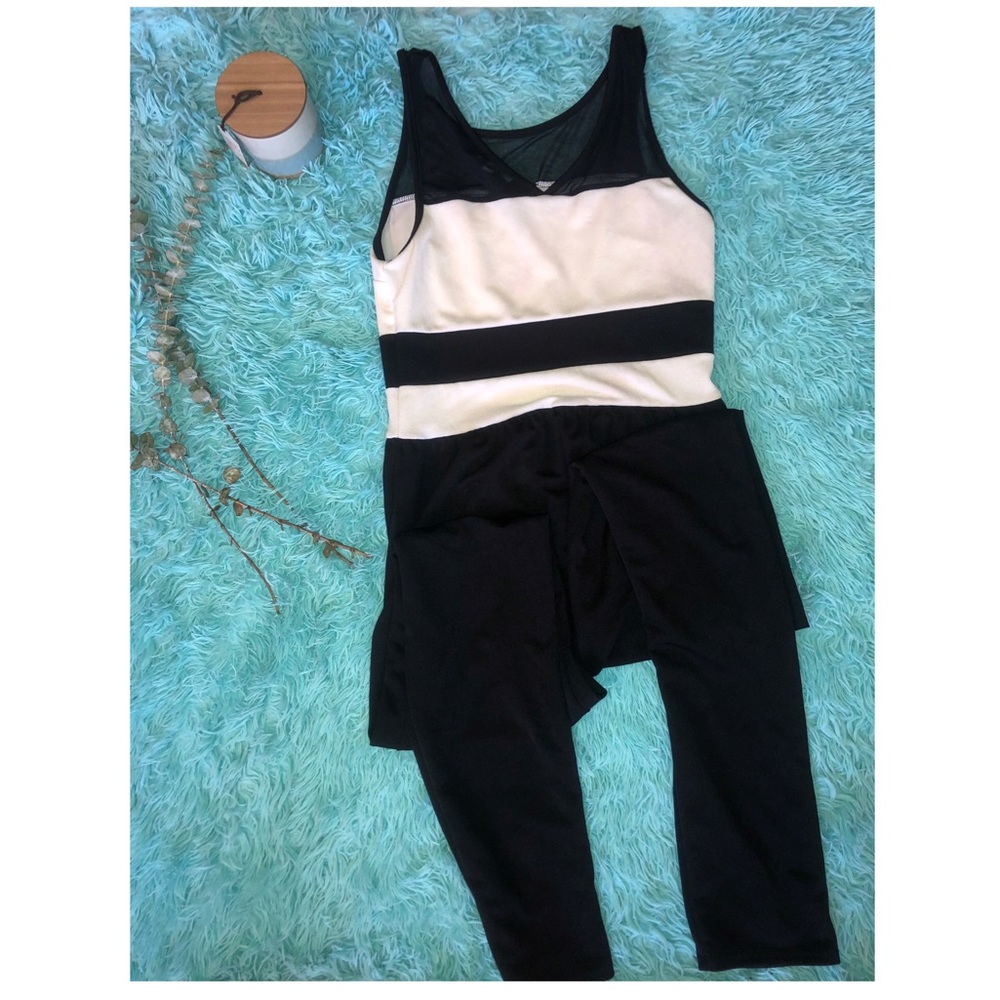 Tall, black and white jumpsuit.